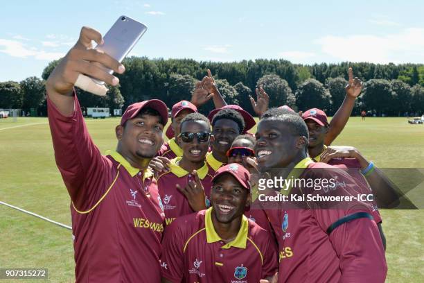 Bhaskar Yadram of the West Indies takes a team selfie after the win in the ICC U19 Cricket World Cup match between the West Indies and Kenya at...