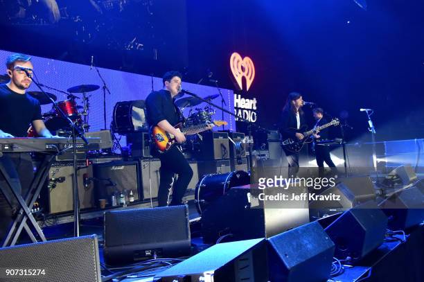 Ben Lovett, Marcus Mumford, Winston Marshall, and Ted Dwane of Mumford & Sons perform onstage during iHeartRadio ALTer Ego 2018 at The Forum on...