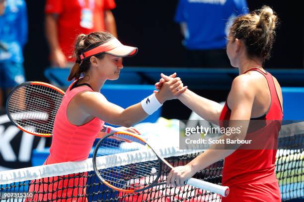 Lauren Davis of the United States congratulates Simona Halep of Romania after Halep won their third round match on day six of the 2018 Australian...