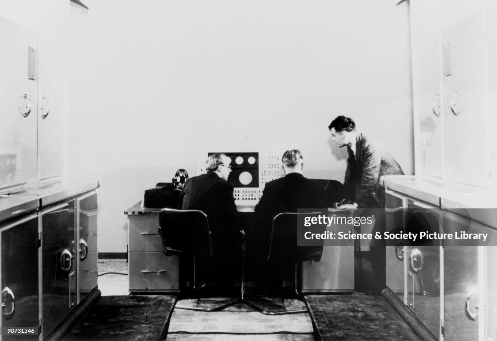 Alan M Turing and colleagues working on the Ferranti Mark I Computer, 1951.