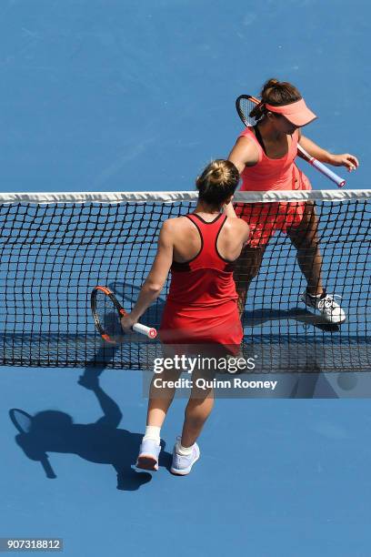 Lauren Davis of the United States congratulates Simona Halep of Romania after Halep won their third round match on day six of the 2018 Australian...