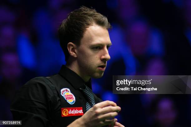 Judd Trump of England chalks the cue during his quarter-final match against Shaun Murphy of England on day six of The Dafabet Masters at Alexandra...