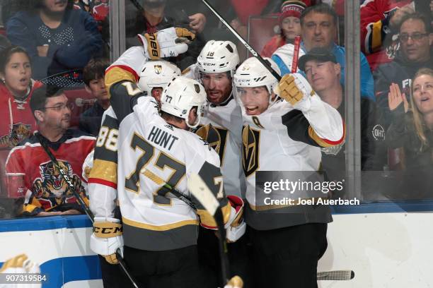 Teammates congratulate James Neal of the Vegas Golden Knights after he scored a third period goal to tie the game against the Florida Panthers at the...