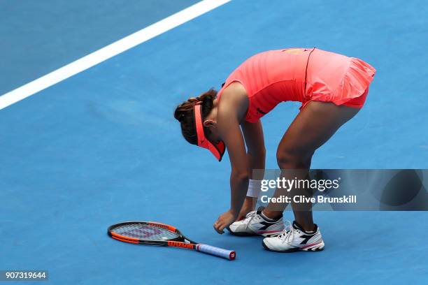 Lauren Davis of the United States struggles with an injured foot in her third round match against Simona Halep of Romania on day six of the 2018...