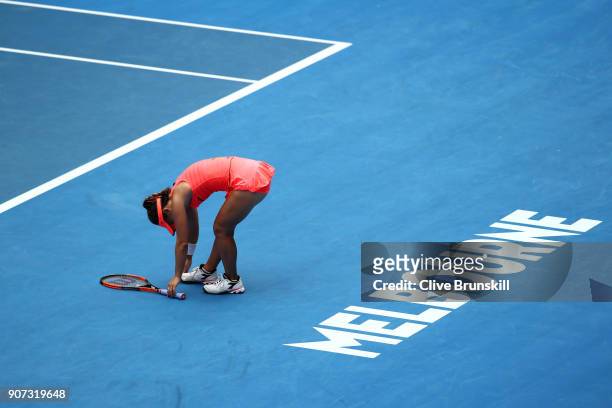 Lauren Davis of the United States struggles with an injured foot in her third round match against Simona Halep of Romania on day six of the 2018...