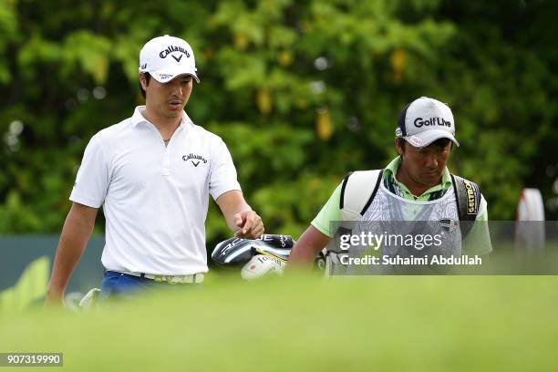 Ryo Ishikawa of Japan walks after teeing tees on the sixteenth hole of Round 2 on day 3 of the Singapore Open at Sentosa Golf Club on January 20,...