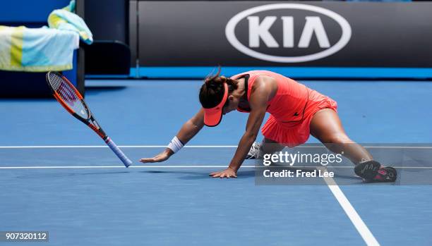 Lauren Davis of the United States falls in the third set of her third round match against Simona Halep of Romania on day six of the 2018 Australian...