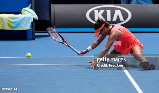 Lauren Davis of the United States falls in the third set of her third round match against Simona Halep of Romania on day six of the 2018 Australian...