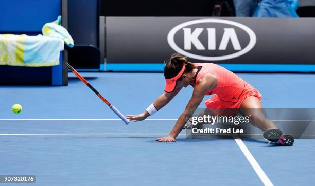 Lauren Davis of the United States falls in the third set of her third round match against Simona Halep of Romania on day six of the 2018 Australian...