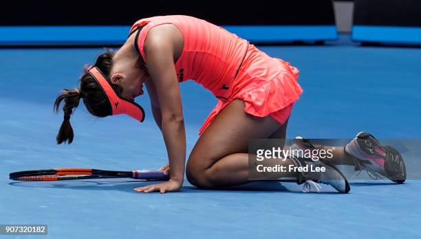Lauren Davis of the United States injures her foot in a fall in her third round match against Simona Halep of Romania on day six of the 2018...