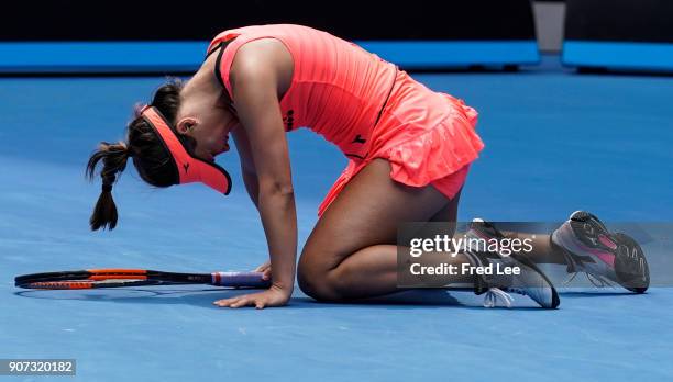 Lauren Davis of the United States injures her foot in a fall in her third round match against Simona Halep of Romania on day six of the 2018...