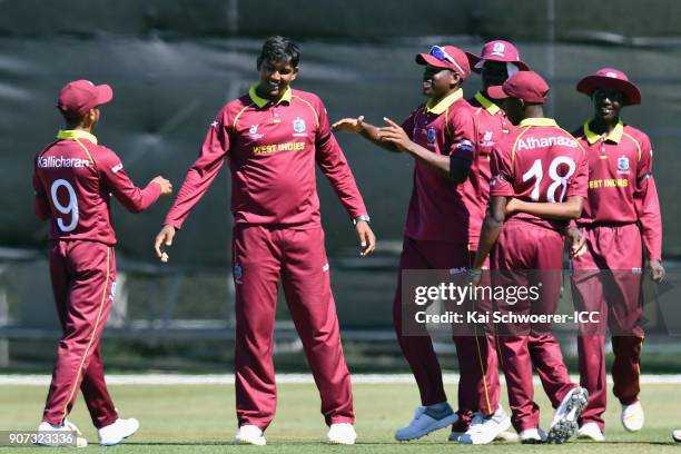 Bhaskar Yadram of the West Indies is congratulated by team mates after dismissing Abhishekh Chidambaran of Kenya during the ICC U19 Cricket World Cup...