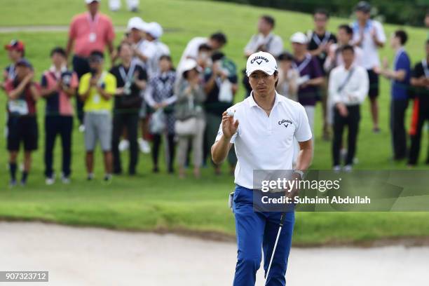 Ryo Ishikawa of Japan gestures on the seventeenth hole of Round 2 on day 3 of the Singapore Open at Sentosa Golf Club on January 20, 2018 in...