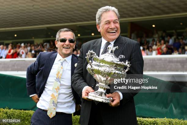 Minister for Racing and Deputy Prime Minister, Winston Peters, enjoys a laugh with former jockey Noel Harris while holding the Wellington Cup during...