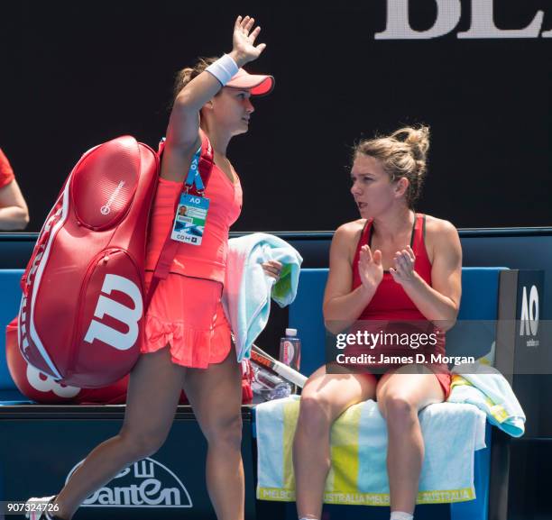 Lauren Davis of the United States waves goodbye to the crowd after her loss to Simona Halep of Romania in a 3 hour 45 minute long match on Rod Laver...