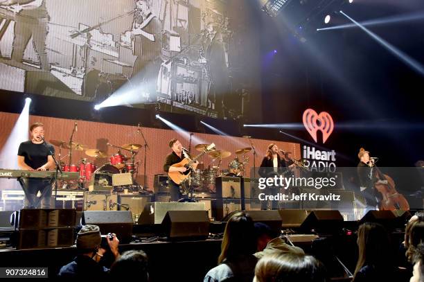 Ben Lovett, Marcus Mumford, Winston Marshall, and Ted Dwane of Mumford & Sons perform onstage during iHeartRadio ALTer Ego 2018 at The Forum on...