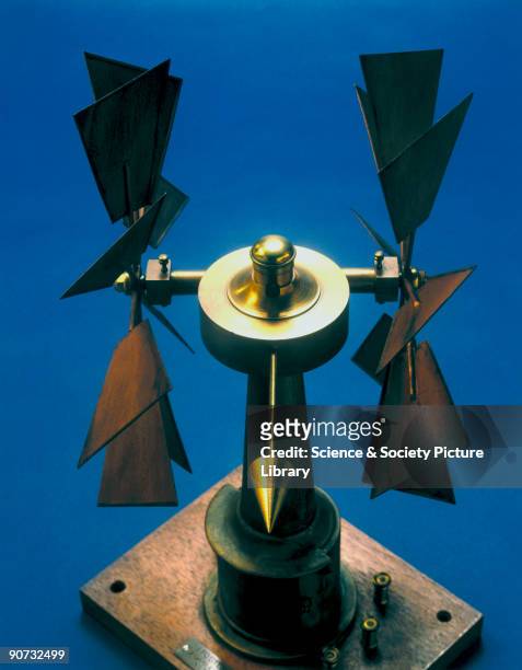 Windmill style anemometer used for measuring wind force, with a pair of eight-blade vanes and a direction pointer. This example was devised by G T...