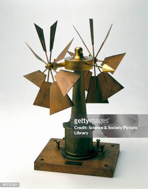 Windmill style anemometer, used for measuring wind force, with a pair of eight-blade vanes and a direction pointer. This example was devised by G T...