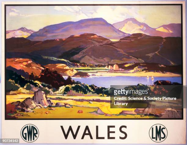Poster produced for the Great Western Railway and London Midland & Scottish Railway, promoting rail travel to Wales, showing a view of a lake in the...