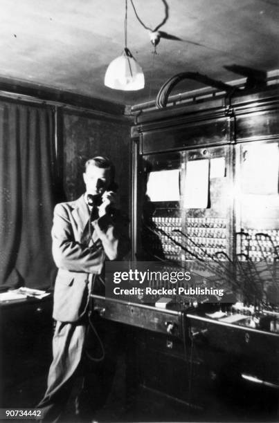 Fred Clarke as a switchboard operator, late 1930s. Frederick William Clarke, the younger brother of Arthur C Clarke, is depicted here using a...