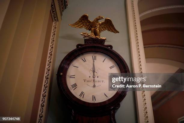 January 20: The Ohio Clock outside the Senate Chamber strikes midnight at the U.S. Capitol January 20, 2018 in Washington, DC. Lawmakers were unable...