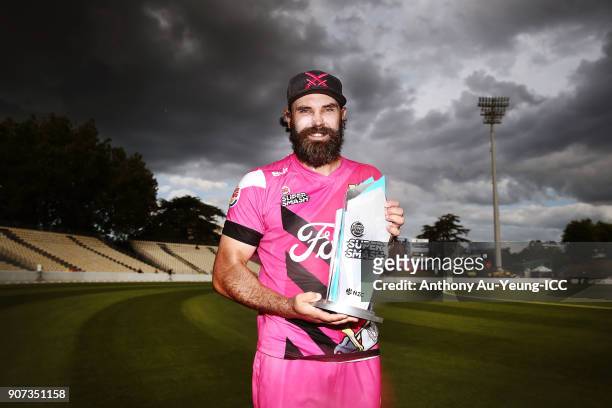 Dean Brownlie of the Knights poses for a photo with the Burger King Super Smash Trophy after winning the Super Smash Grand Final match between the...