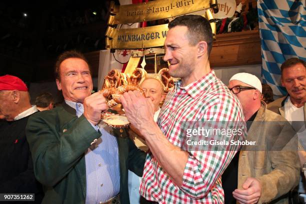 Arnold Schwarzenegger, and Wladimir Klitschko during the 27th Weisswurstparty at Hotel Stanglwirt on January 19, 2018 in Going near Kitzbuehel...