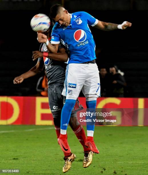 Ayron del Valle of Millonarios heads the ball over Ivan Velez of America de Cali during the friendly match between Millonarios and America de Cali as...