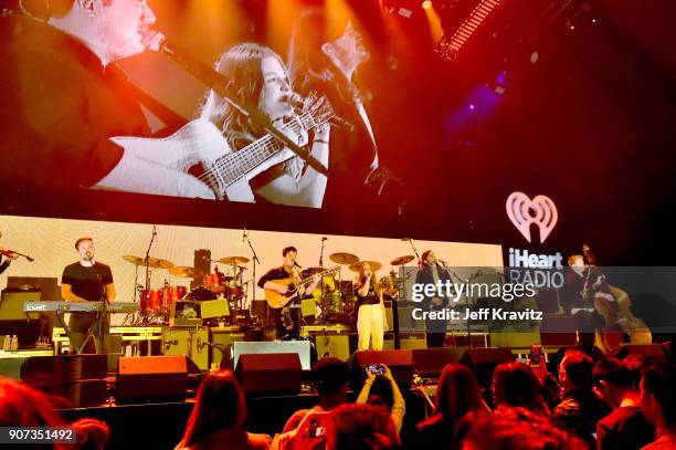 Maggie Rogers and Ben Lovett, Marcus Mumford, Winston Marshall, and Ted Dwane of Mumford & Sons perform onstage during iHeartRadio ALTer Ego 2018 at...