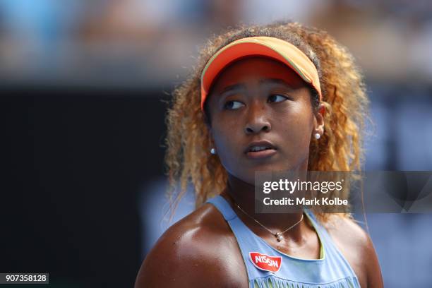 Naomi Osaka of Japan looks on in her third round match against Ashleigh Barty of Australia on day six of the 2018 Australian Open at Melbourne Park...