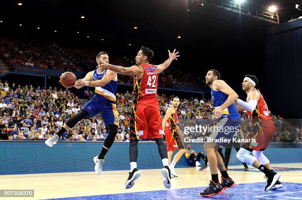 Adam Gibson of the Bullets passes the ball during the round 15 NBL match between the Brisbane Bullets and Melbourne United at Brisbane Entertainment...