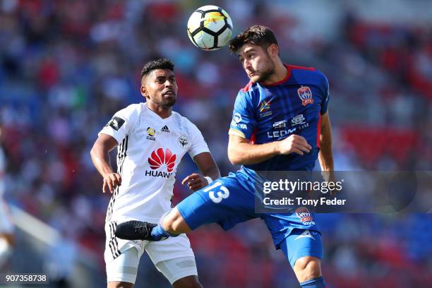 Ivan Vujica of the Jets contests the ball with Roy krishna of the Phoenix during the round 17 A-League match between the Newcastle Jets and...