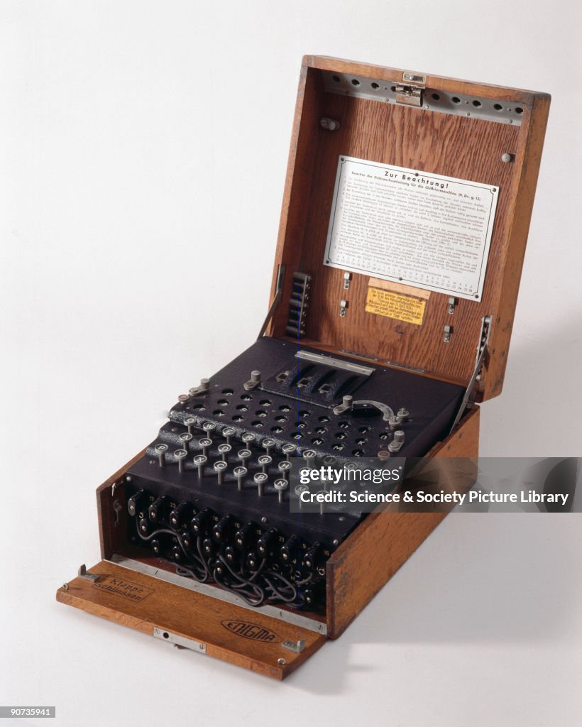 Three-ring Enigma cypher machine in wooden transit case, c 1930s.