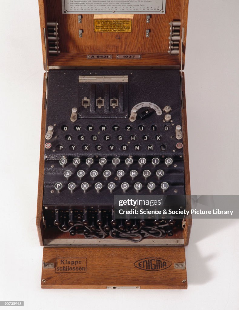 Three-ring Enigma cypher machine in wooden transit case, c 1930s.