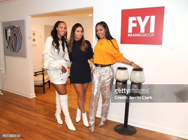 Nyanda Donaldson, FYI Brand Group Founder Tammy Brook and Gabrielle Foucher attend the "For Your Information" Pop-Up Art Show hosted by FYI Brand...