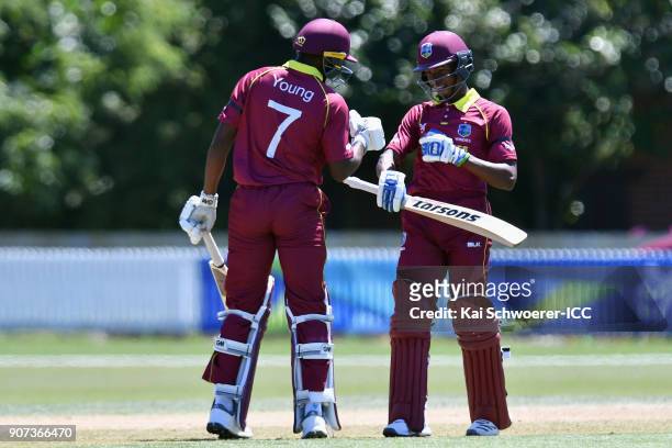 Alick Athanaze of the West Indies is congratulated by Nyeem Young of the West Indies after scoring a century during the ICC U19 Cricket World Cup...