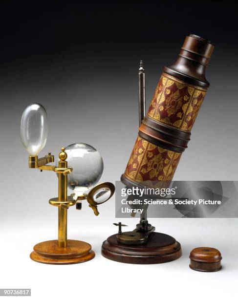 Microscope associated with Robert Hooke , shown with a copy of the illuminating system used. This microscope, among the scientific instruments...