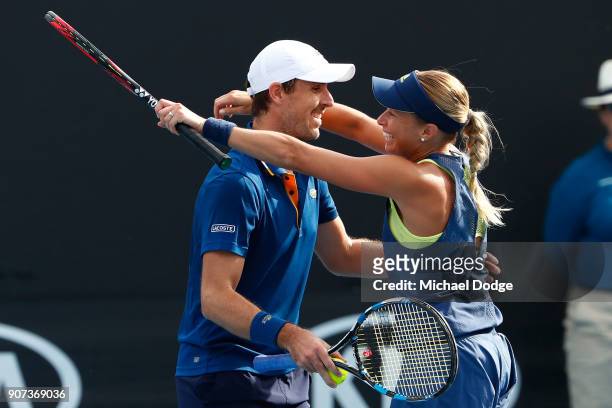Andrea Sestini Hlavackova of the Czech Republic and Edouard Roger-Vasselin of France celebrate after winning their first round mixed doubles match...