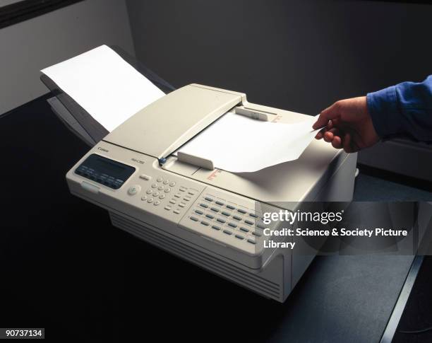 Fax machine reads an image from one piece of paper, then sends the image over a telephone line, where another fax machine receives it and prints out...
