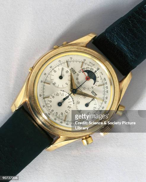 Wristwatch in a gold case made by Universal of Geneva, Switzerland. On the left of the main dial is a subsidiary seconds dial, directly opposite is a...