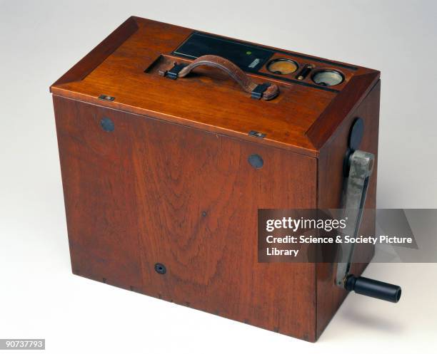 Radio transmitter in a teak case, complete with a hand-driven generator.