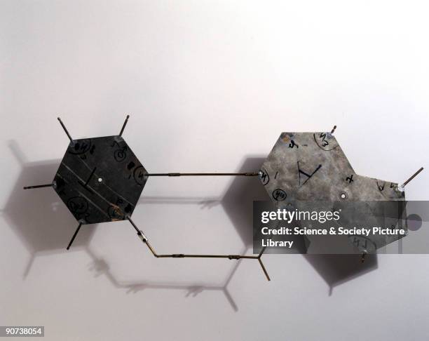 These aluminium templates are part of a model representing the structure of DNA. The plates represent bases, those groups of atoms that make up DNA's...