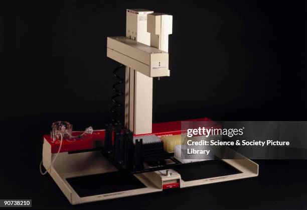 This laboratory robot was programmed to put two precisely measured amounts of liquid into the wells on two different plates, which is part of the...