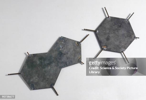 These aluminium templates are part of a model representing the structure of DNA. The plates represent bases, those groups of atoms that make up DNA's...