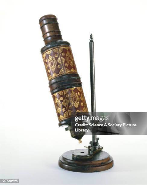 Microscope associated with Robert Hooke , shown with a copy of the illuminating system used. This microscope, among the scientific instruments...