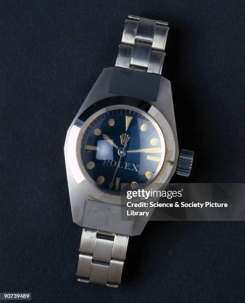 Duplicate, without movement, of a Rolex Oyster wristwatch which remained waterproof at a depth of seven miles. The original model was fixed to the...