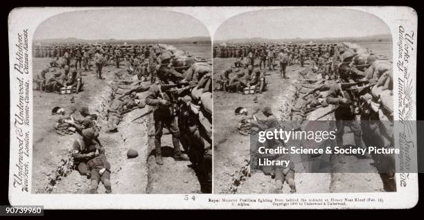 Soldiers behind a sandbagged redoubt. Wounded are being tended, suggesting a recent attack. One of a boxed set of stereoscope photographs produced...