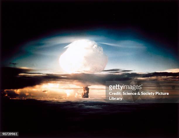 The mushroom cloud produced by the first explosion by the Americans of a hydrogen bomb at Eniwetok Atoll in the South Pacific. Known as Operation...