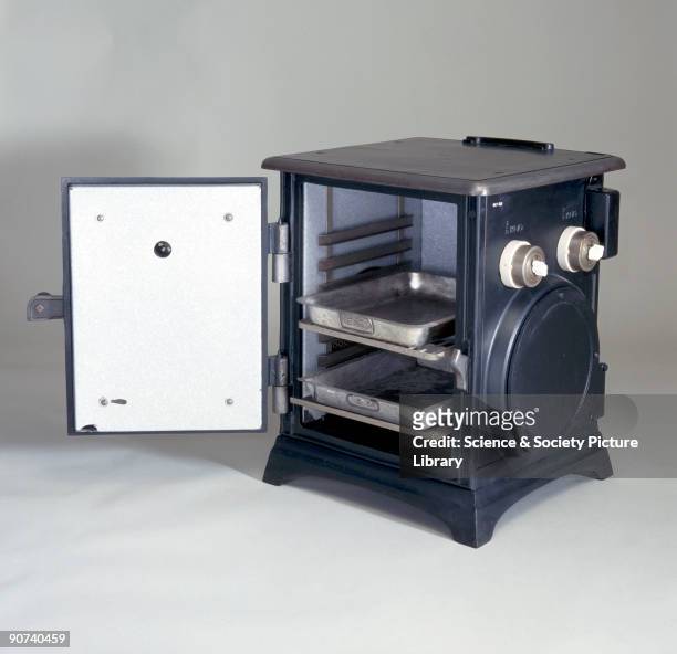 This model was made by the General Electric Company between 1905 and 1910. The cast iron oven is heated on each side by two circular heating elements...