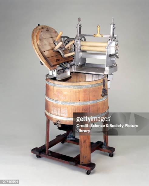Electrically driven, with a mangle made by Beatty Bros of Canada. This interesting machine shows how electricity was first used to drive a...